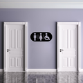 Accessible Male & Female Toilet Sign | Inclusive Bathroom Sign displayed on a modern restroom wall between two white doors.