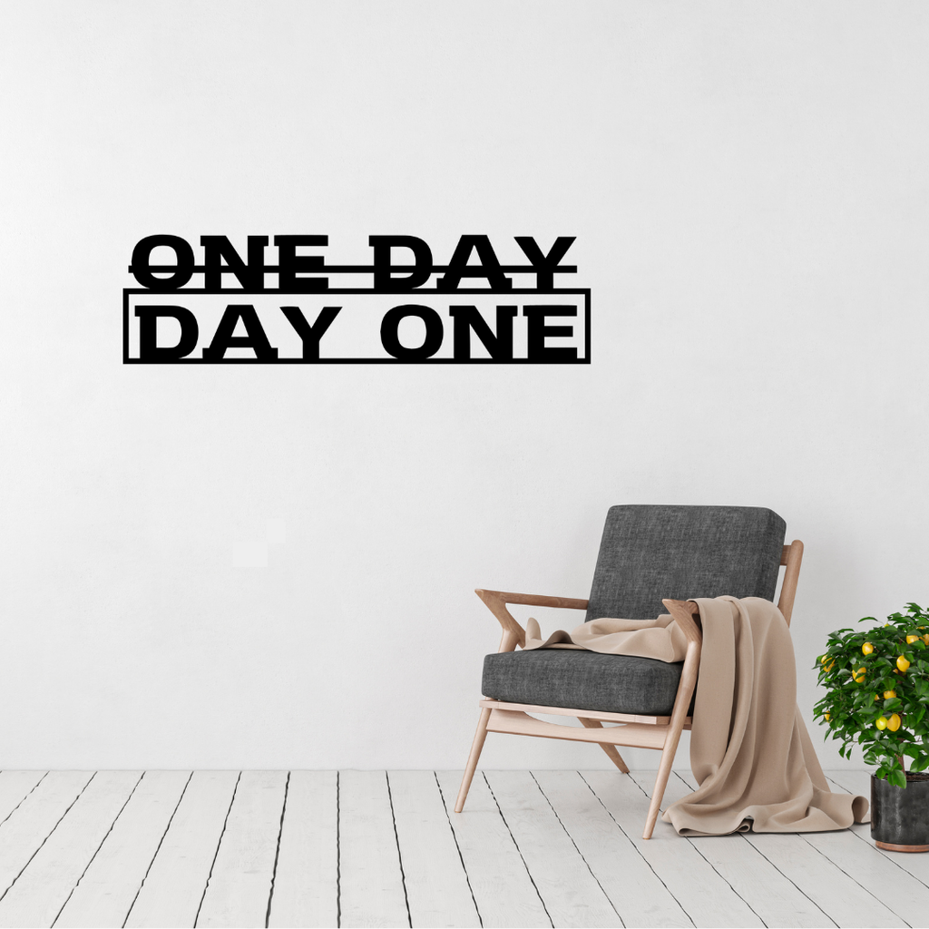 Action Taker | One Day or Day One Metal Wall Art displayed in a modern living room.