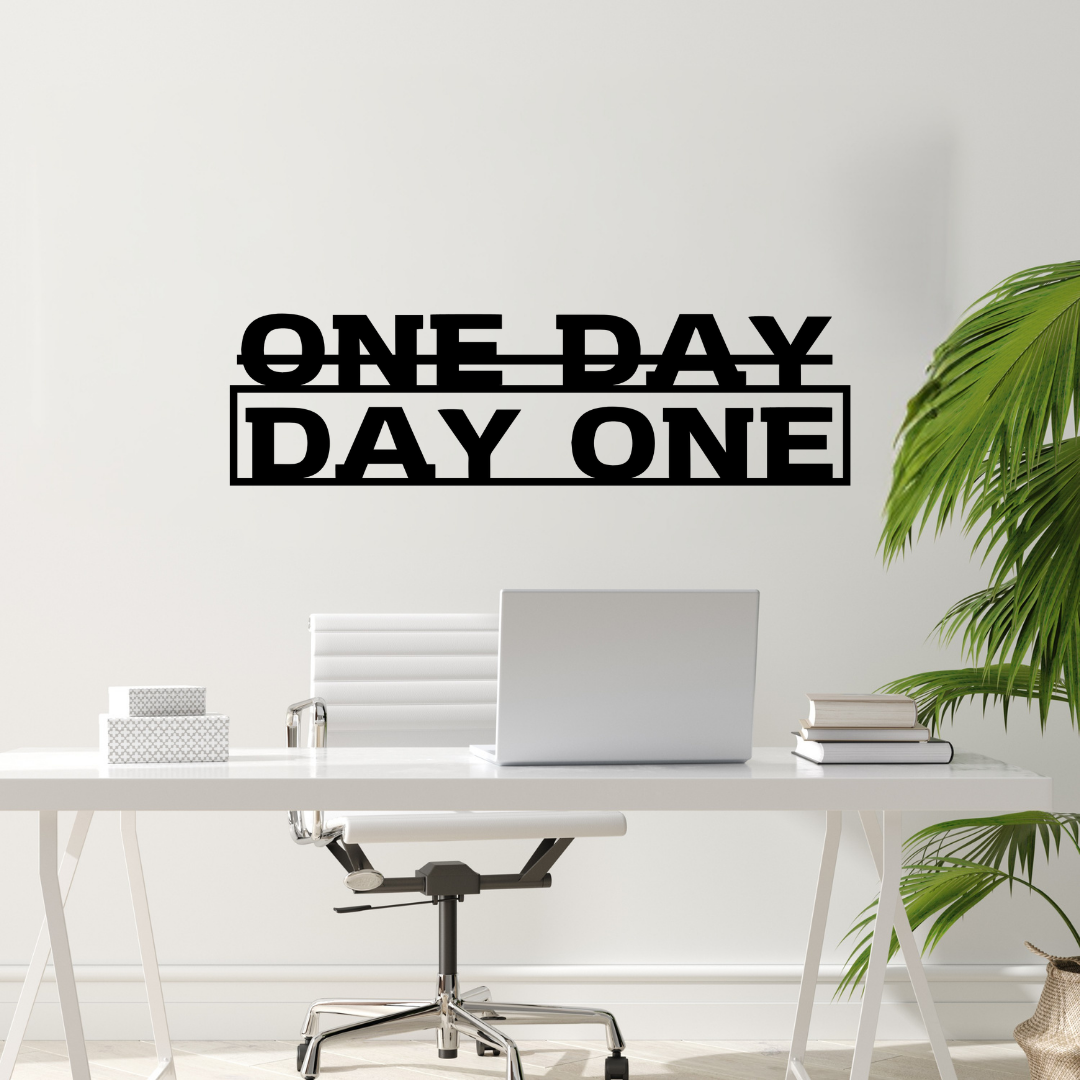Action Taker | One Day or Day One Metal Wall Art showcased in a contemporary office above a desk.