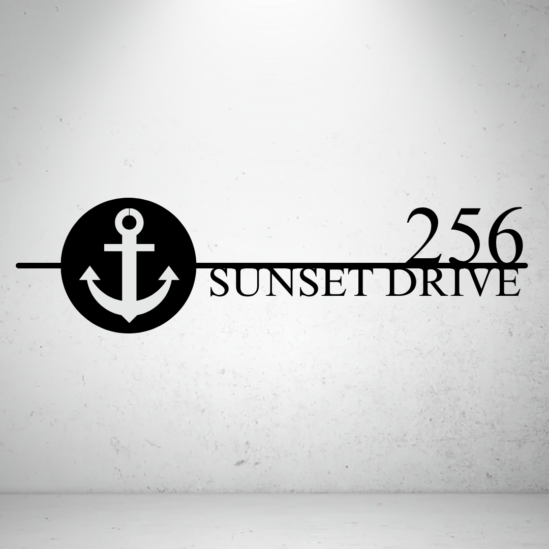 Metal house number sign with nautical anchor design on a grey background