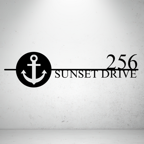 Metal house number sign with nautical anchor design on a grey background