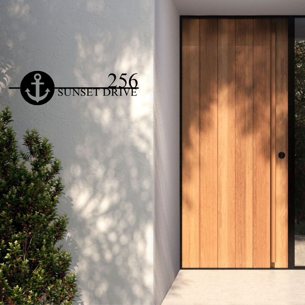 Metal house number anchor address sign mounted at a coastal home entrance