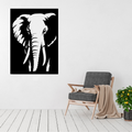 Ancient Presence elephant metal wall art displayed above a contemporary chair in a stylish modern interior