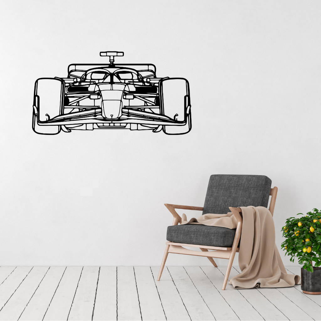 Apex Racer Formula One metal wall art displayed above a modern armchair in a minimalist living room.