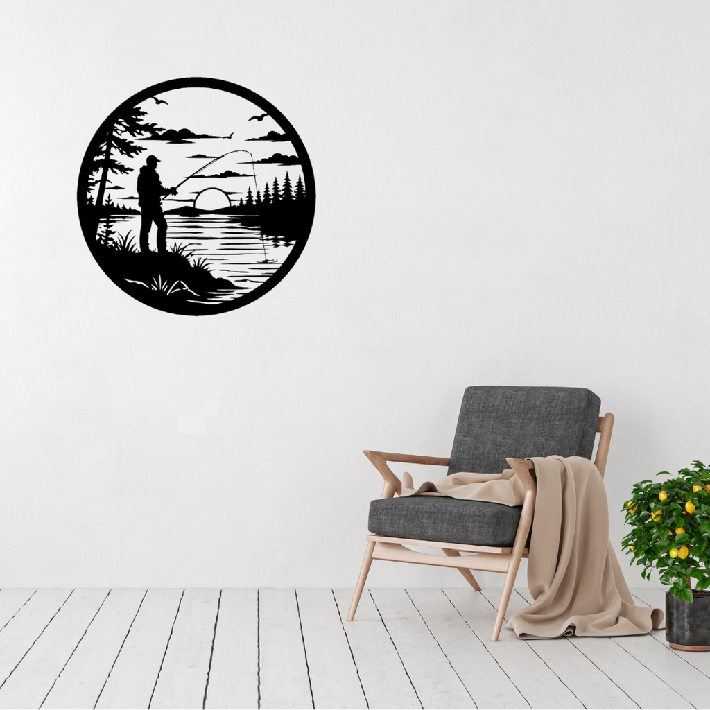 Last Cast | Angler Sunset Metal Wall Art displayed in a bright modern living room, featuring a lone fisherman casting a line across a peaceful lake at sunset, surrounded by pine trees in a circular black metal design, perfect for fishing enthusiasts, cabins and contemporary rustic décor.