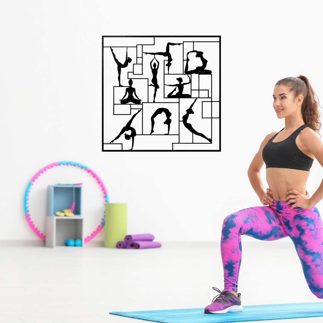 Balance & Flow Yoga Silhouettes metal wall art displayed in a bright fitness and yoga studio above workout equipment.