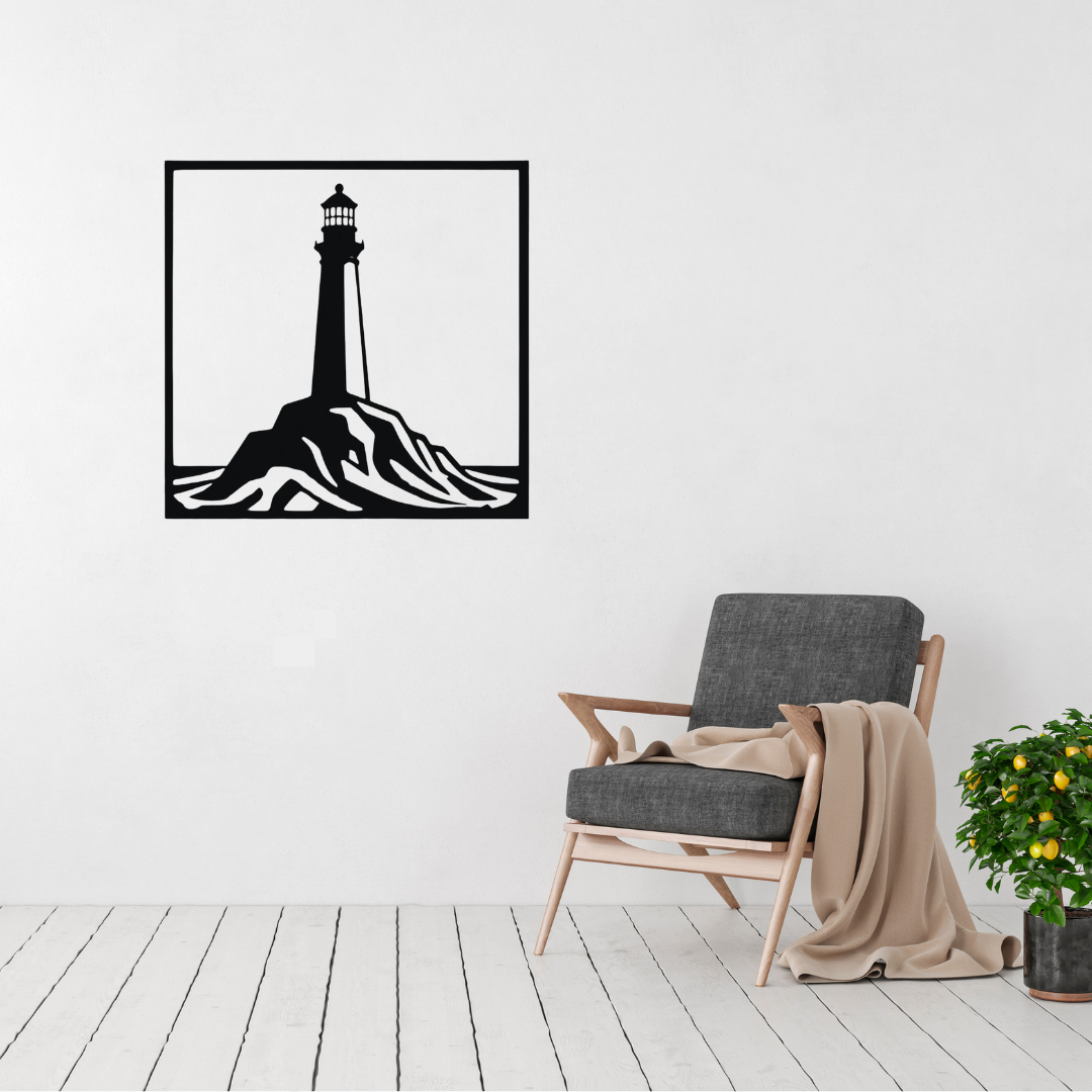 Beacon on the Rocks | Lighthouse Metal Wall Art displayed on a modern living room wall above a grey accent chair, featuring a coastal lighthouse standing atop rugged rocks in a minimalist square black metal design.