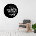 Beautiful Reasons inspirational typography metal wall art displayed above a modern accent chair, featuring the quote "There are so many beautiful reasons to be happy" in a circular laser-cut steel design.