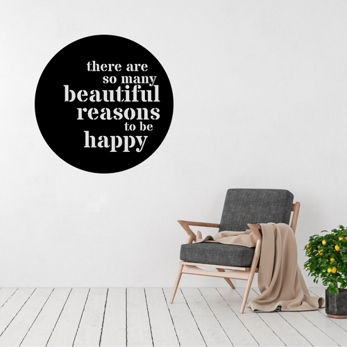 Beautiful Reasons inspirational typography metal wall art displayed above a modern accent chair, featuring the quote "There are so many beautiful reasons to be happy" in a circular laser-cut steel design.