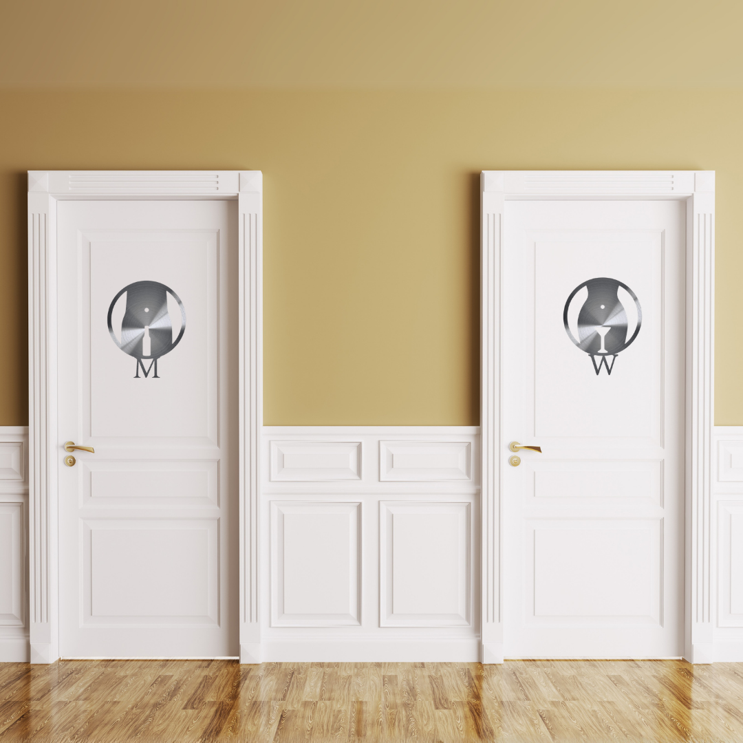 Cheers & Chardonnay | Men's & Women's Bathroom Metal Sign Set mounted on restroom doors, showcasing modern laser-cut steel male and female toilet signs with beer and wine icons.