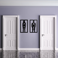 Cheers & Relief funny male and female metal toilet signs mounted between two restroom doors in a modern interior.