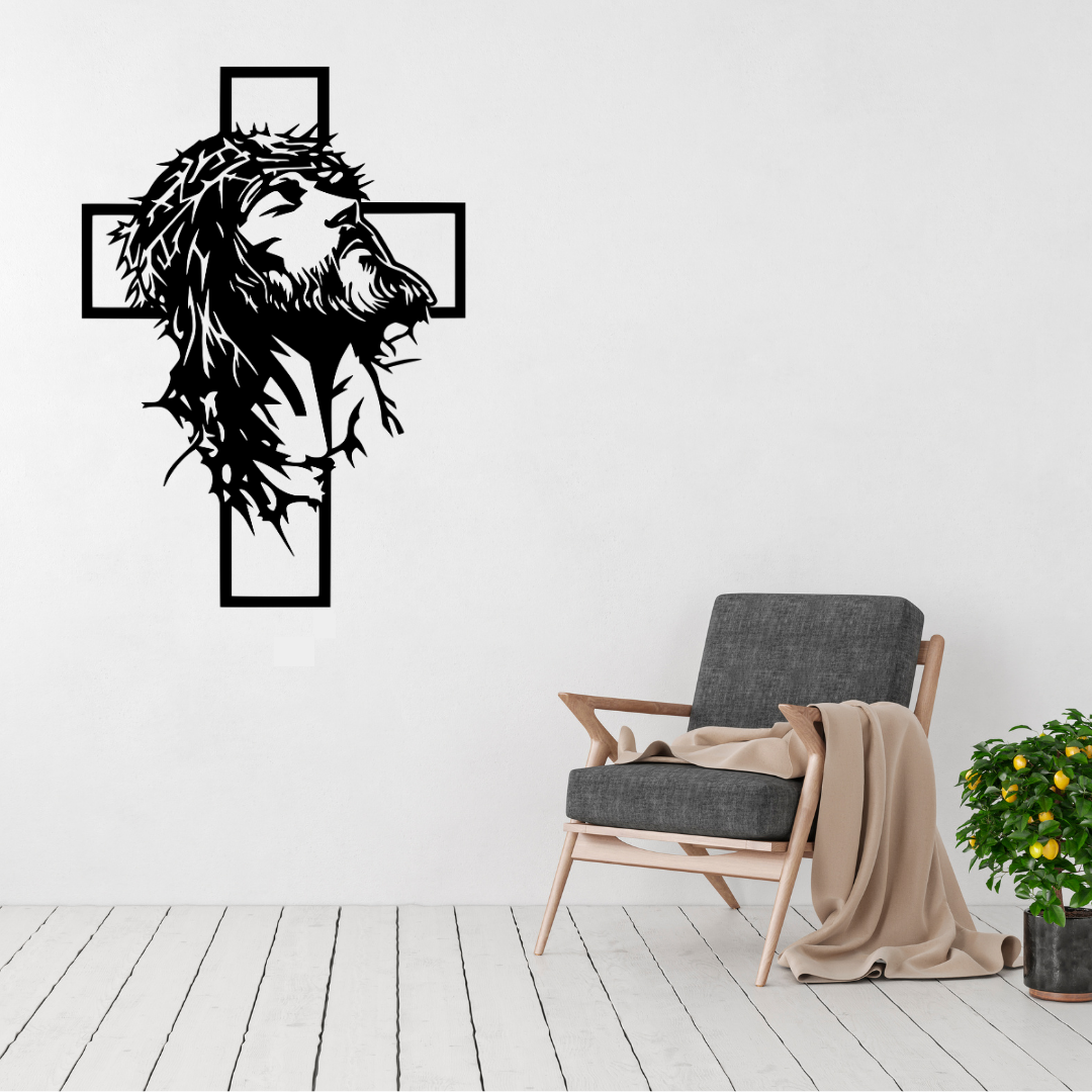 Christ in the Cross Jesus metal wall art displayed above a contemporary chair in a modern interior