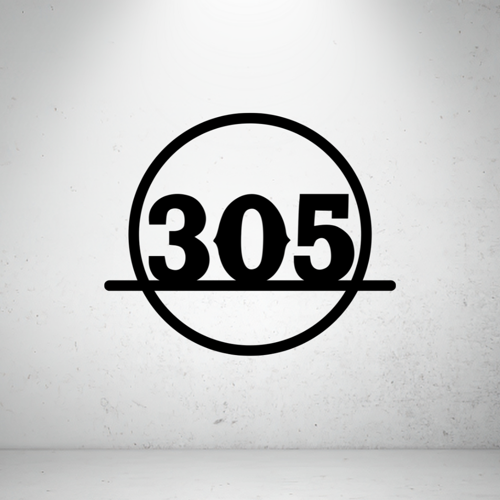 Modern circular metal house number sign featuring bold custom numbers framed within a minimalist circular border.