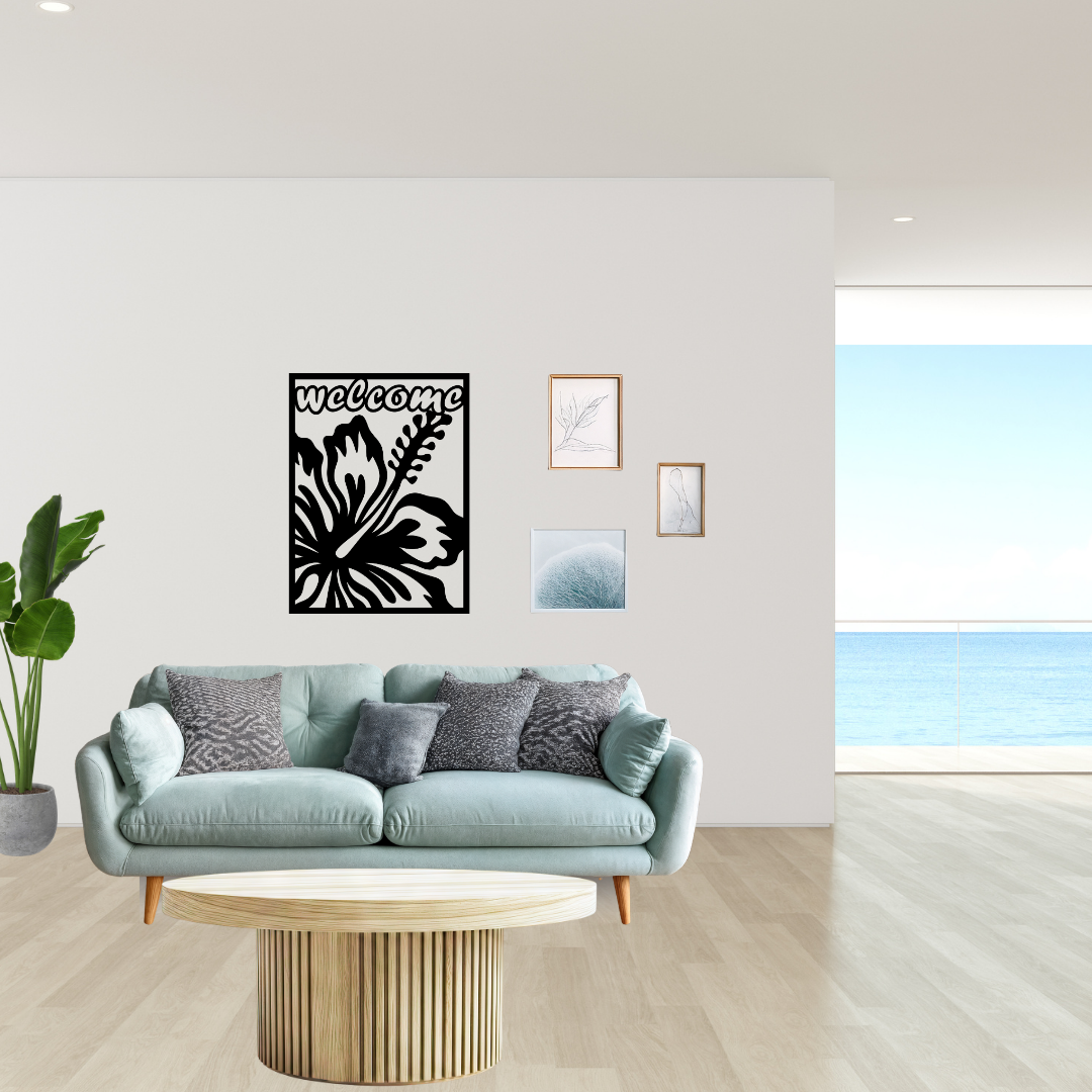 Coastal Retreat tropical welcome metal wall décor mounted above a sofa in a contemporary coastal-inspired living space.