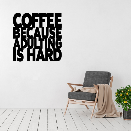 Coffee Because Adulting Is Hard | Funny Coffee Metal Wall Art displayed above a modern accent chair in a contemporary living space.