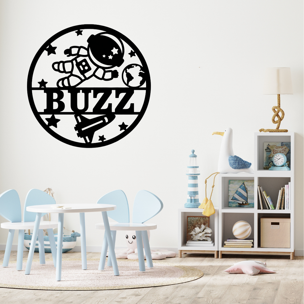 Outer space wall décor styled above a child’s bed with planet accessories