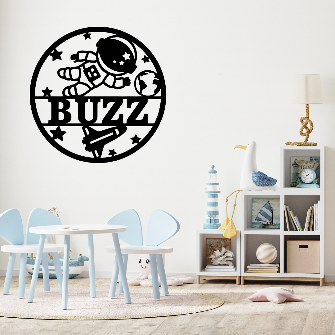 Outer space wall décor styled above a child’s bed with planet accessories