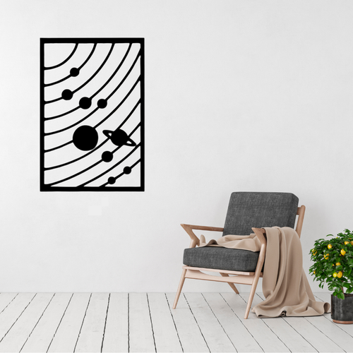 Cosmic Orbit Solar System Metal Wall Art displayed in a bright, modern living room above a contemporary armchair.