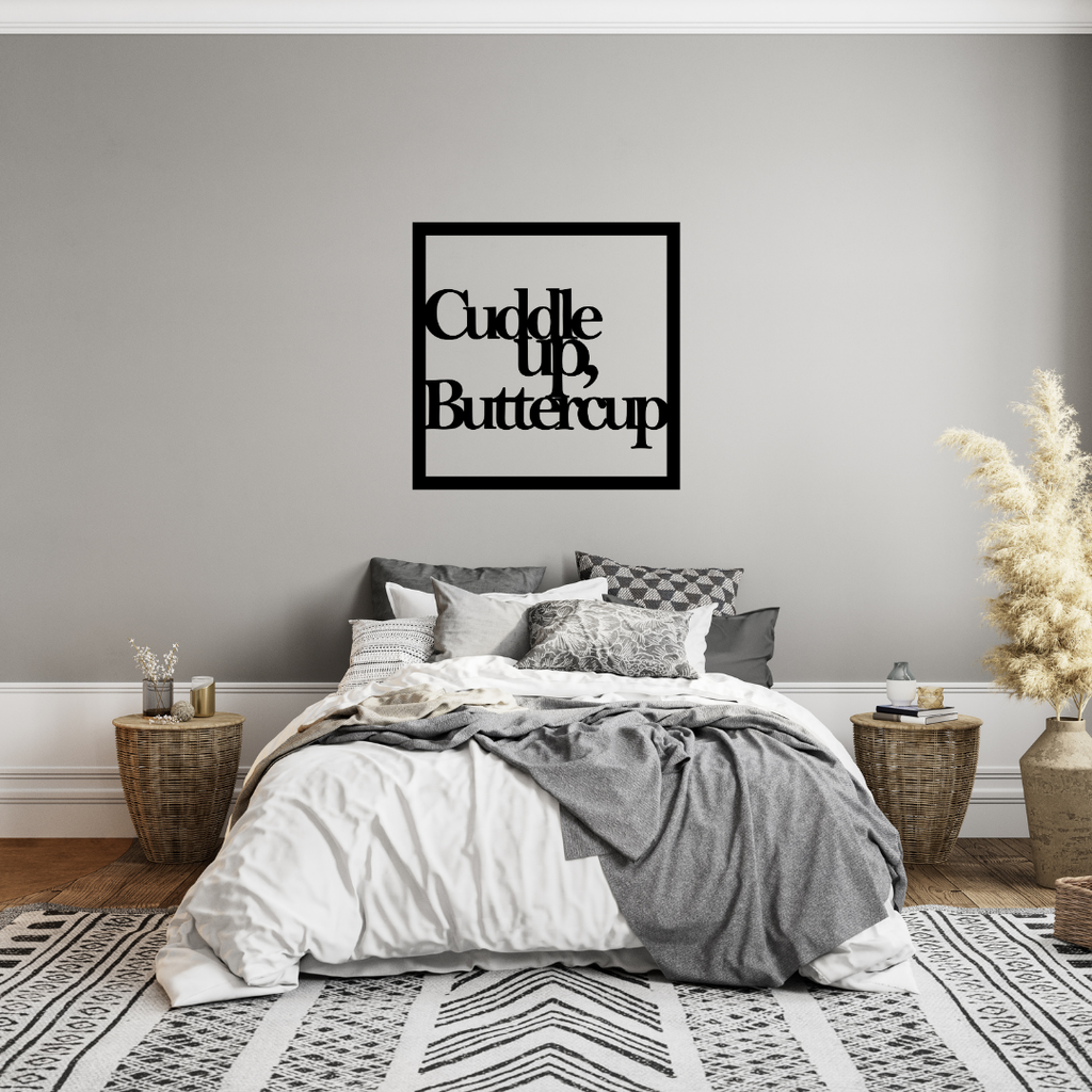 Cuddle Up Buttercup | Bedroom Quote Metal Wall Art showcased above a modern bed in a cosy contemporary bedroom.