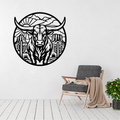 Desert Longhorn | Longhorn Bull Circular Metal Wall Art showcased above a modern accent chair, featuring a striking western-inspired desert landscape with a longhorn bull, cacti, and mountain scenery in precision-cut metal.