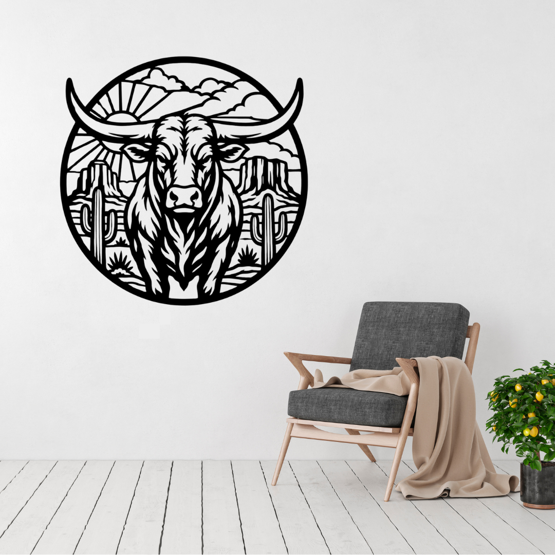 Desert Longhorn | Longhorn Bull Circular Metal Wall Art showcased above a modern accent chair, featuring a striking western-inspired desert landscape with a longhorn bull, cacti, and mountain scenery in precision-cut metal.