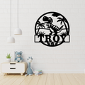 Dinosaur island wall art displayed in a playful nursery room