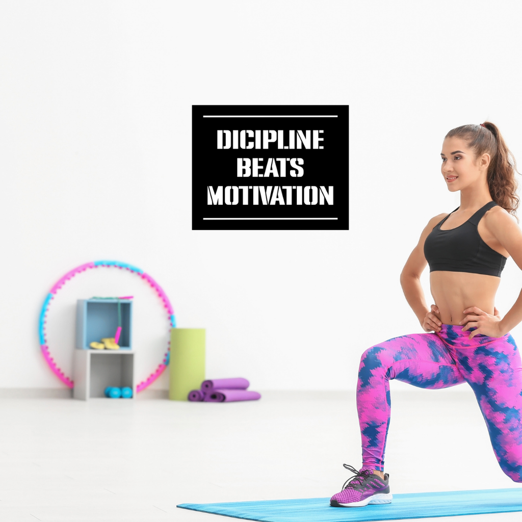 Discipline Beats Motivation motivational typography metal wall art displayed in a contemporary home gym, inspiring focus and consistency during workouts.