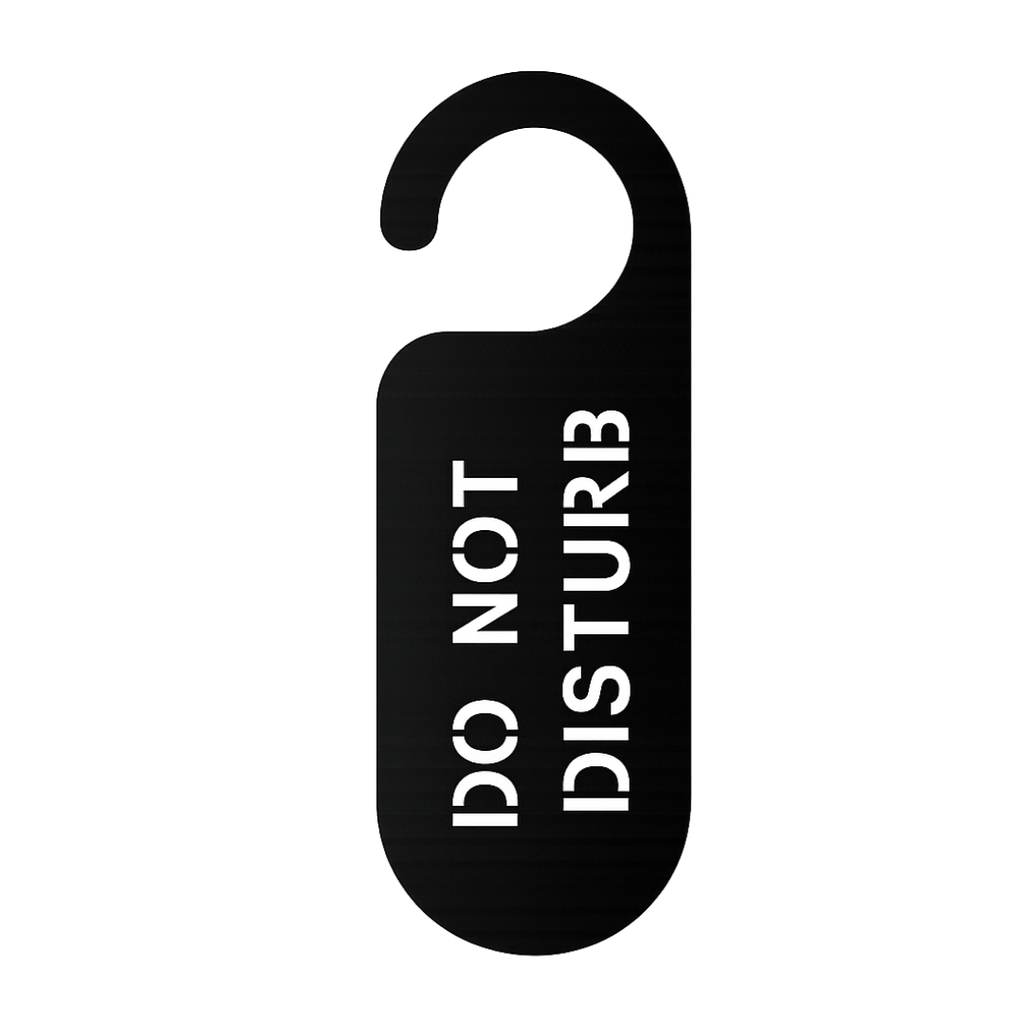 Close-up of the laser-cut Do Not Disturb metal door hanger sign with minimalist typography and matte black finish.