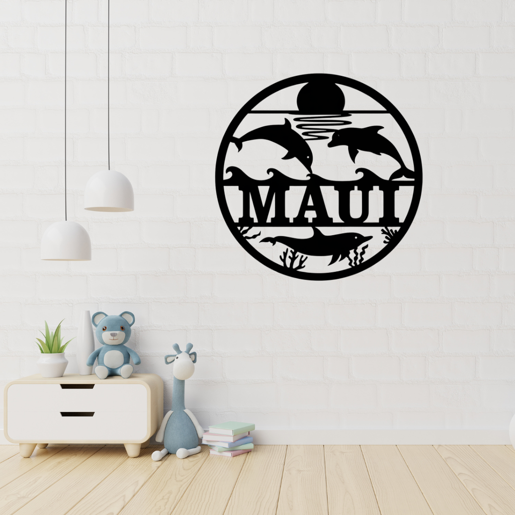 Dolphin metal wall art displayed in a coastal-themed nursery