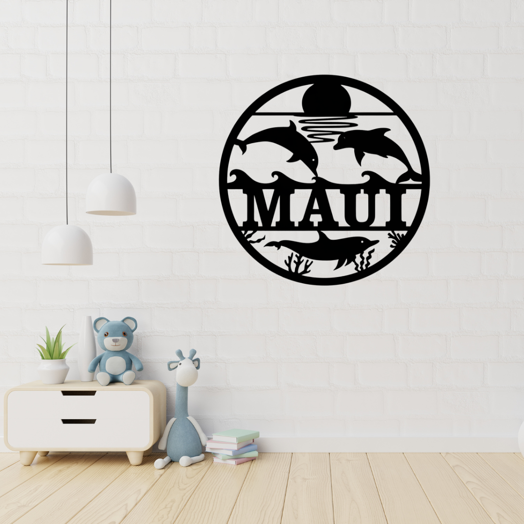 Dolphin metal wall art displayed in a coastal-themed nursery
