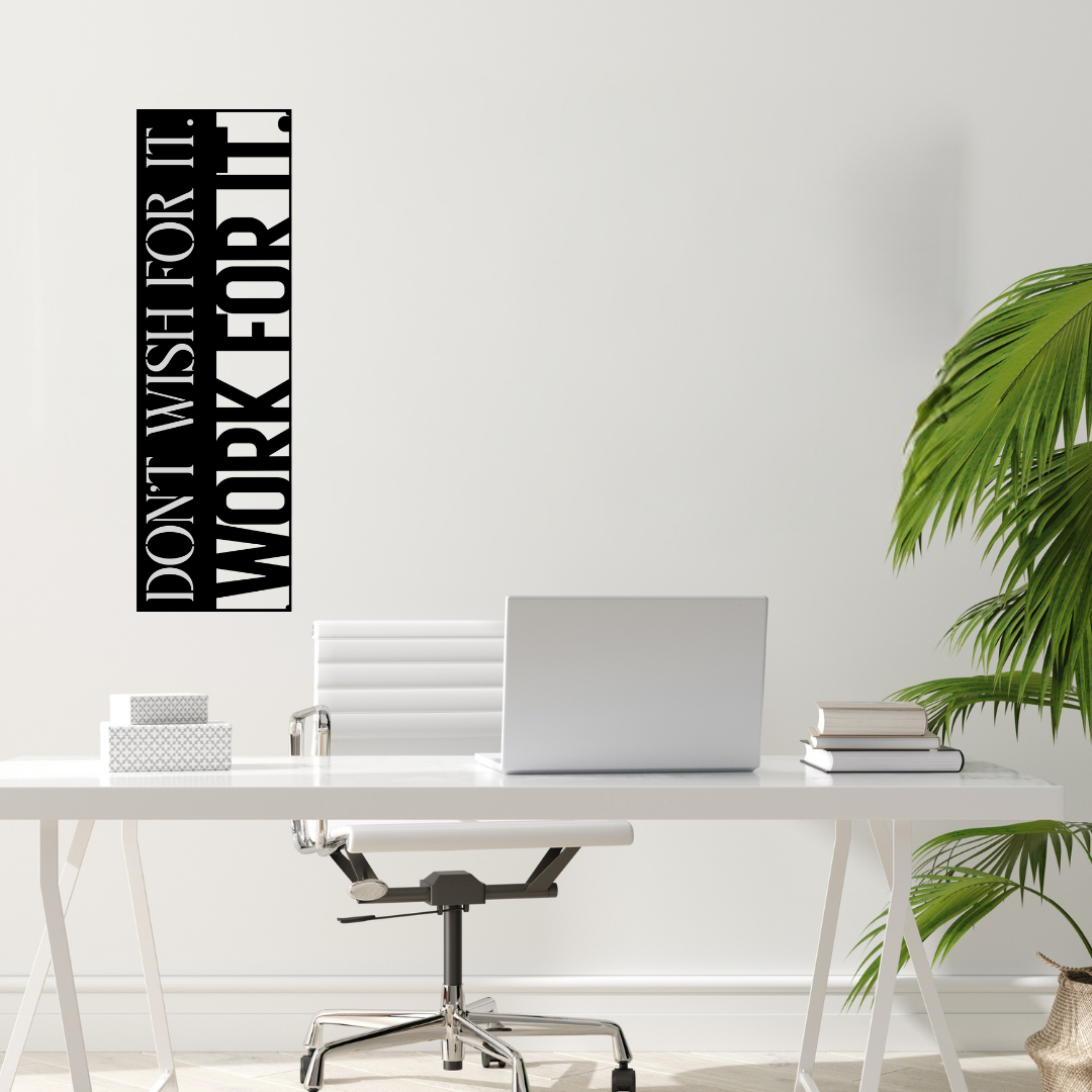 Don't Wish For It, Work For It motivational metal wall art displayed above a modern office desk, creating an inspiring workspace with minimalist décor.