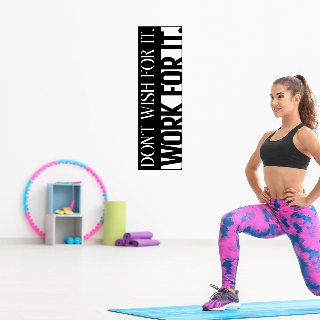 Don't Wish For It, Work For It motivational metal wall art displayed in a contemporary home gym, encouraging dedication and hard work during fitness training.