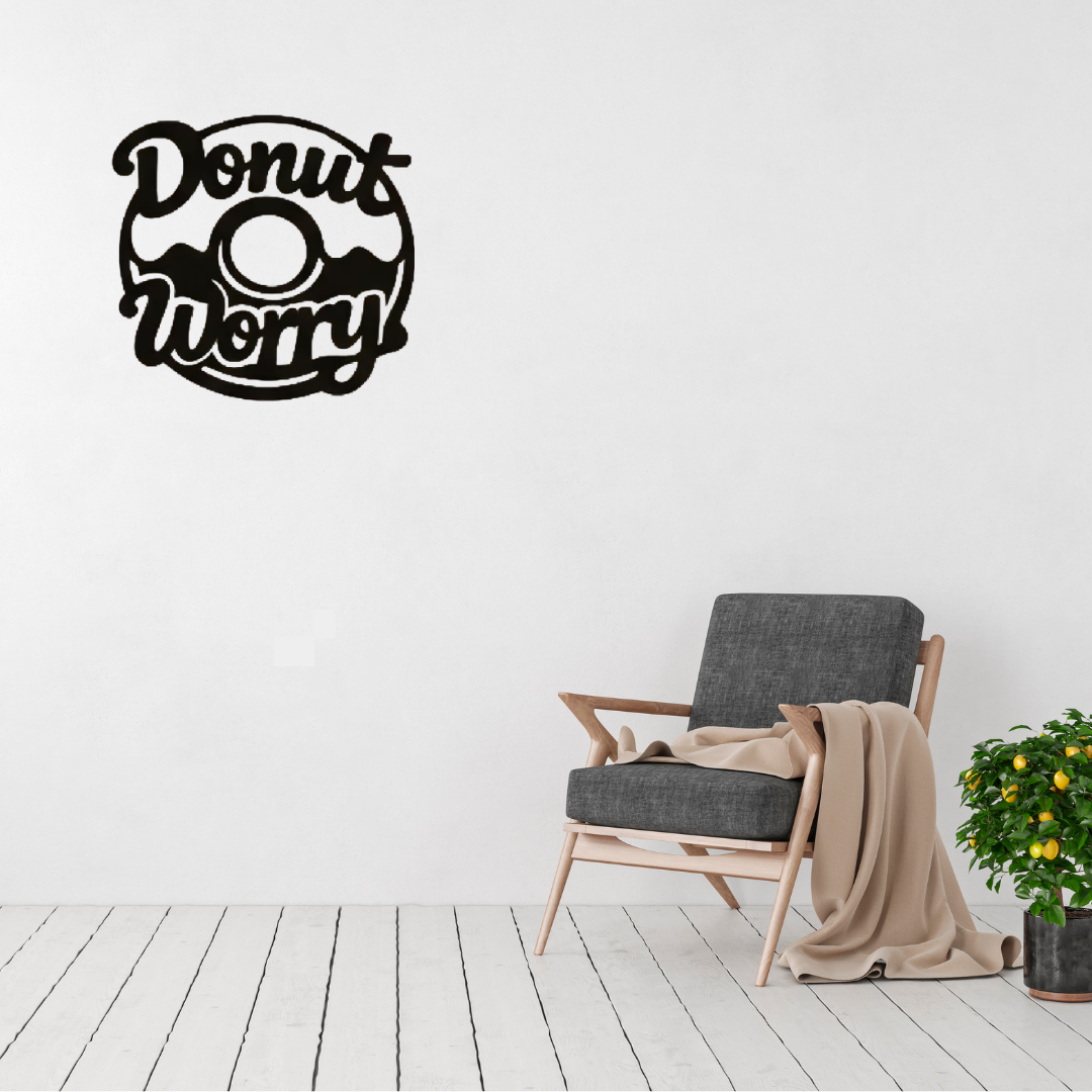 Donut Worry | Humorous Kitchen Metal Wall Art displayed in a bright modern home, featuring a playful doughnut illustration with the cheerful phrase "Donut Worry."