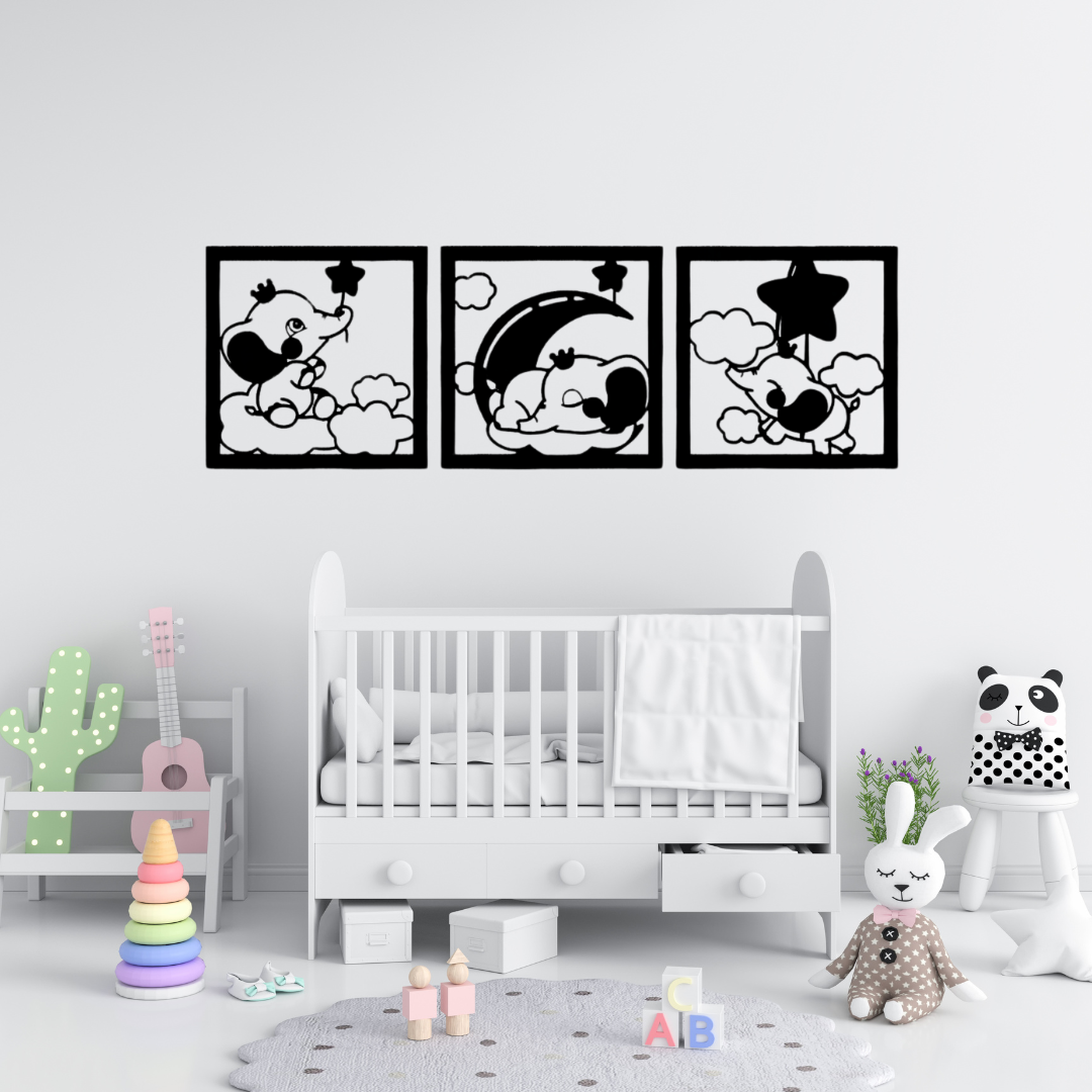 Dreamy Elephant Trio | Nursery Metal Wall Art Set showcased above a baby cot, creating a charming nursery focal point with playful elephant, moon, cloud, and star designs in black metal.