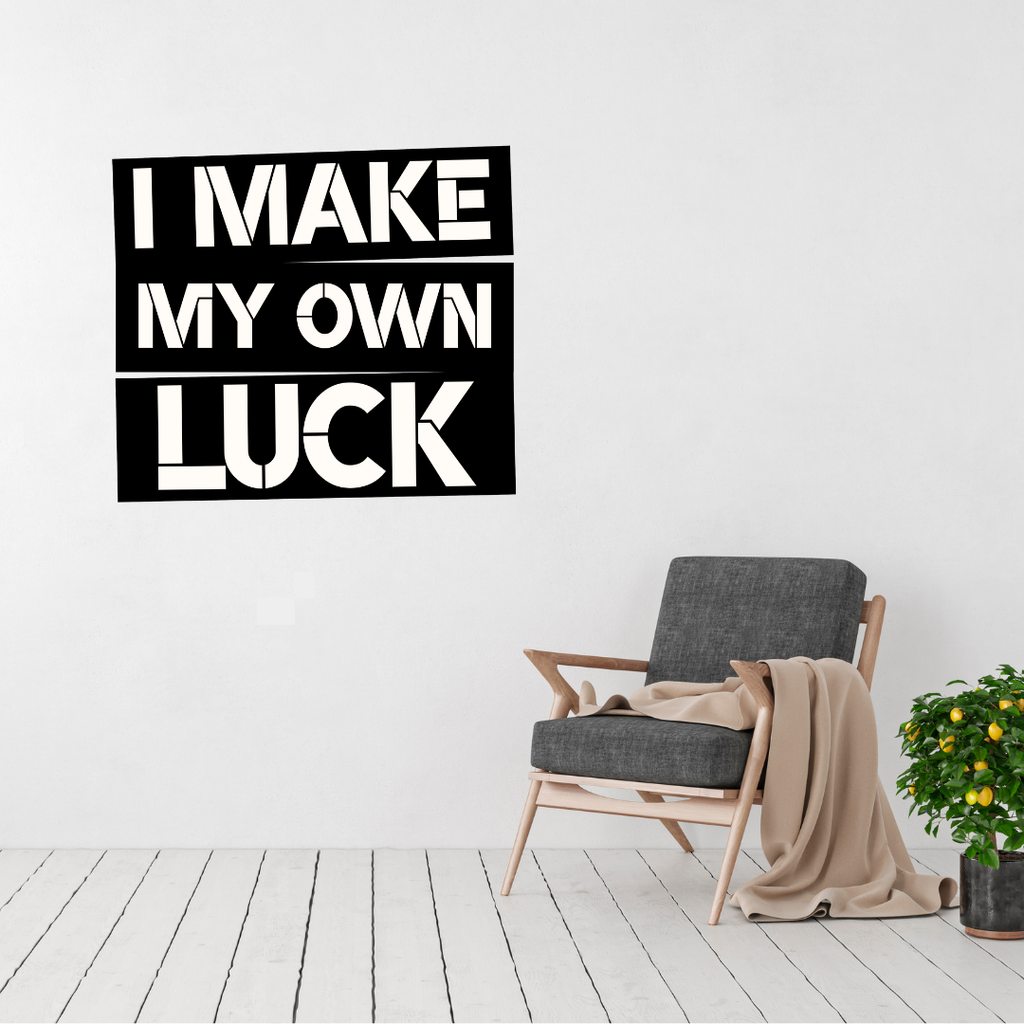 Driven by Determination | I Make My Own Luck Metal Wall Art displayed in a modern living room.