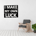 Driven by Determination | I Make My Own Luck Metal Wall Art displayed in a modern living room.