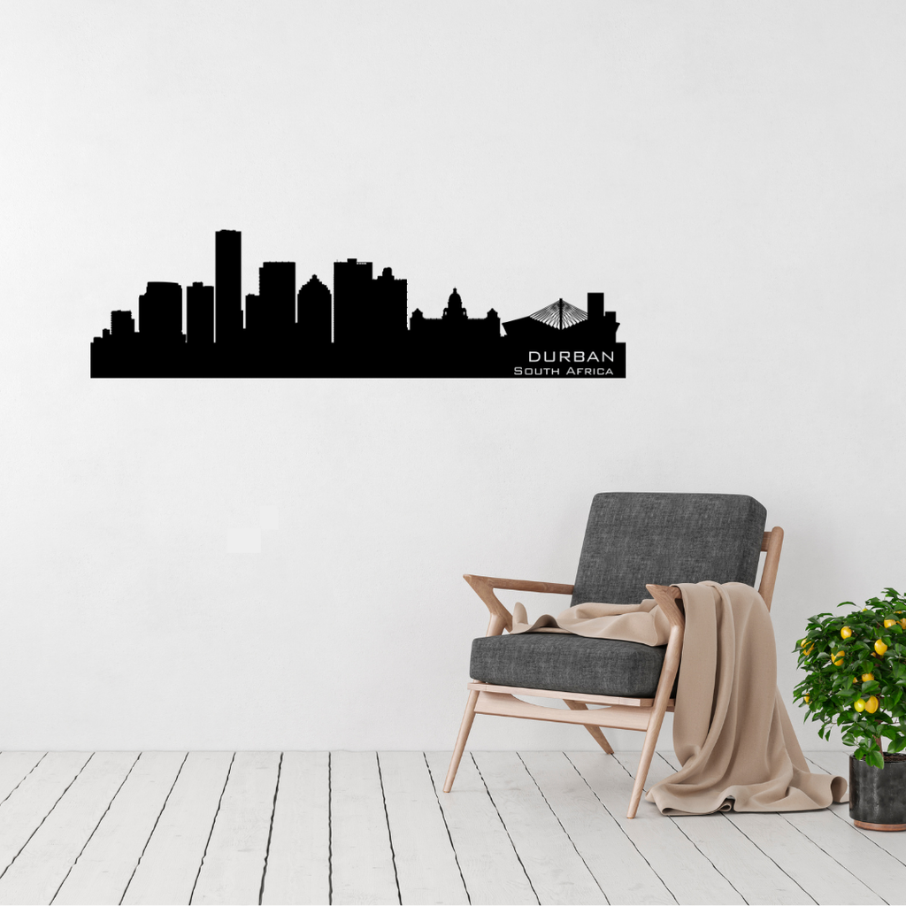 Durban South Africa skyline metal wall art featuring Moses Mabhida Stadium displayed above a contemporary chair