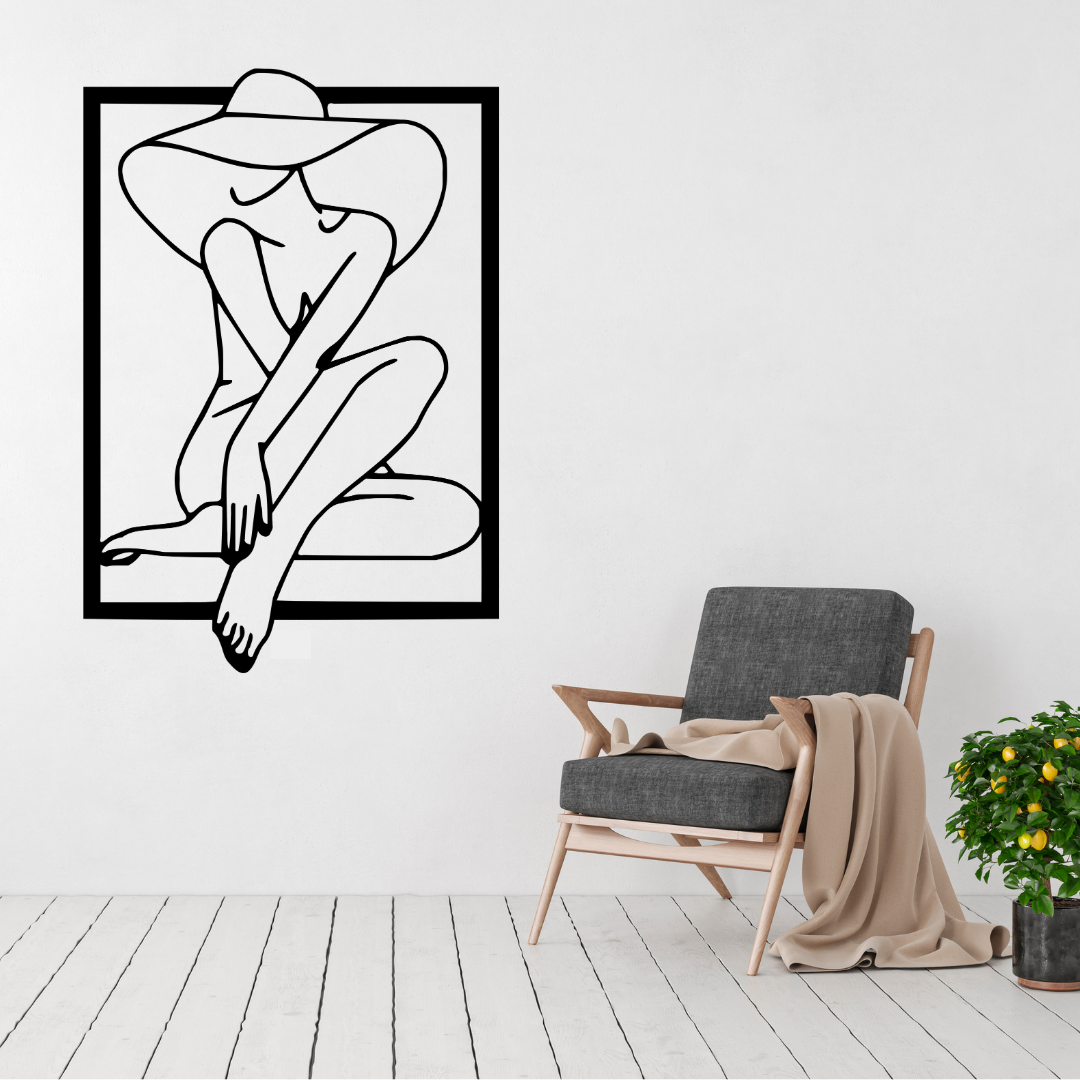 Elegant Mystery woman in hat metal wall art displayed above a contemporary chair in a stylish modern interior