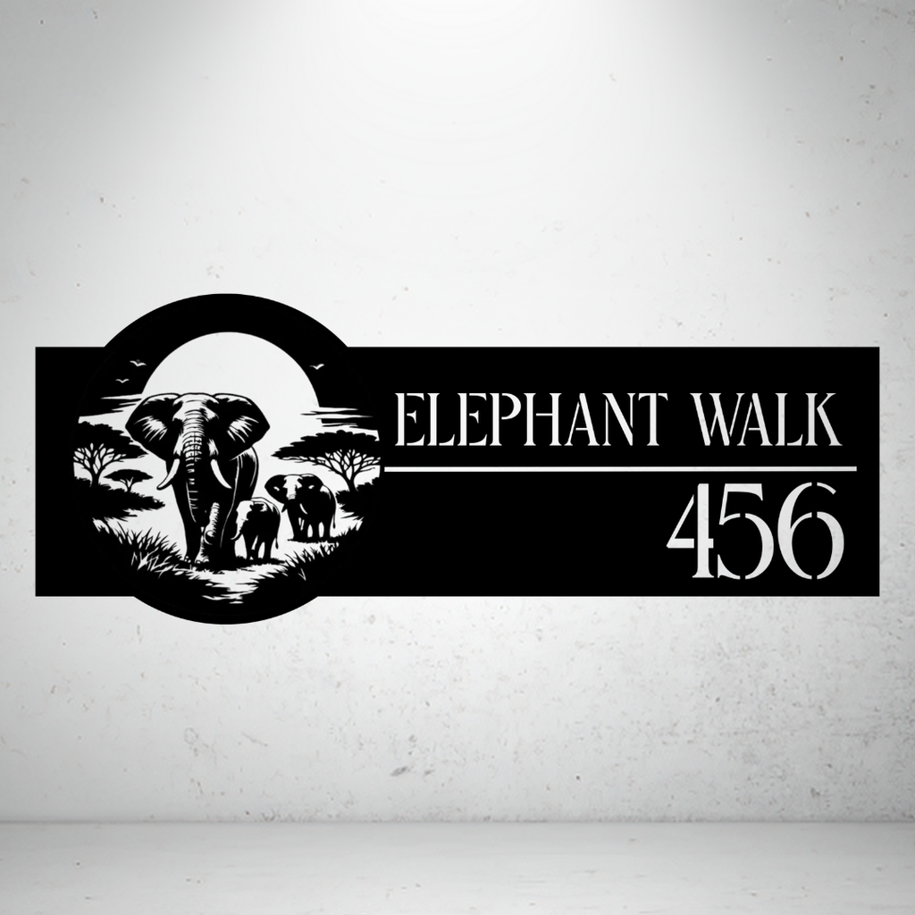 Elephant Walk personalised safari metal house number sign displayed on a concrete wall.