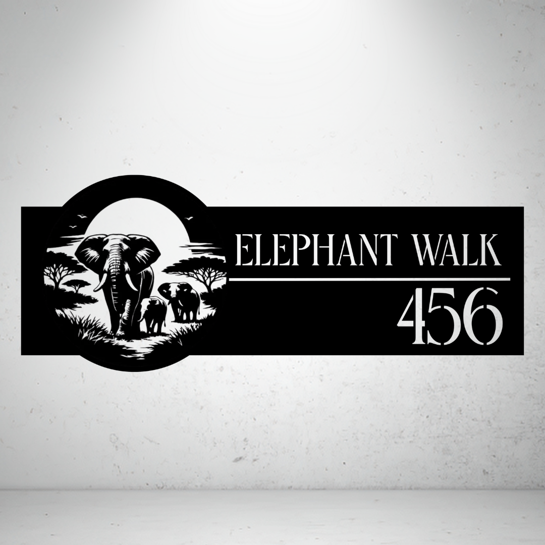 Elephant Walk personalised safari metal house number sign displayed on a concrete wall.