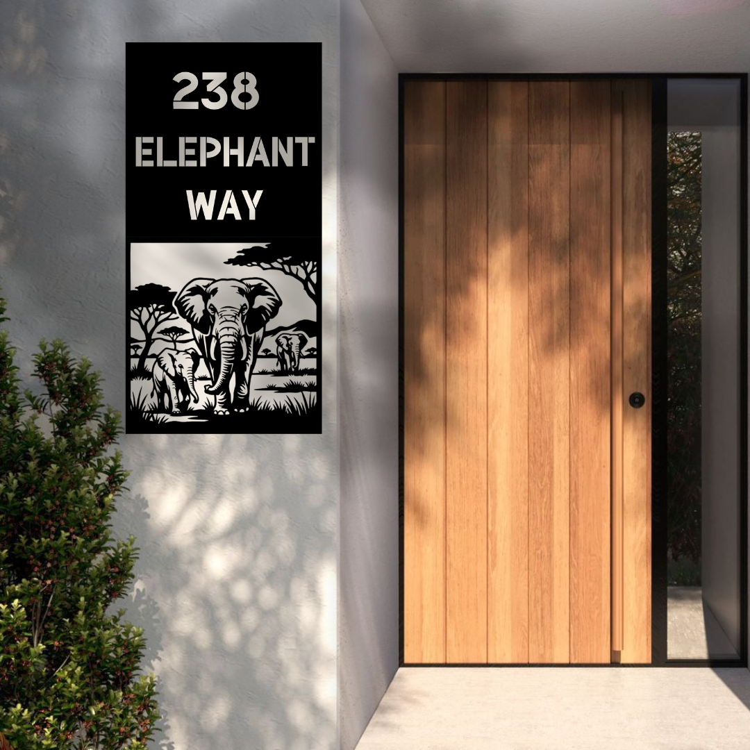 Elephant Way African elephant family custom vertical metal house number sign installed on a modern rendered wall beside a contemporary timber entrance door.