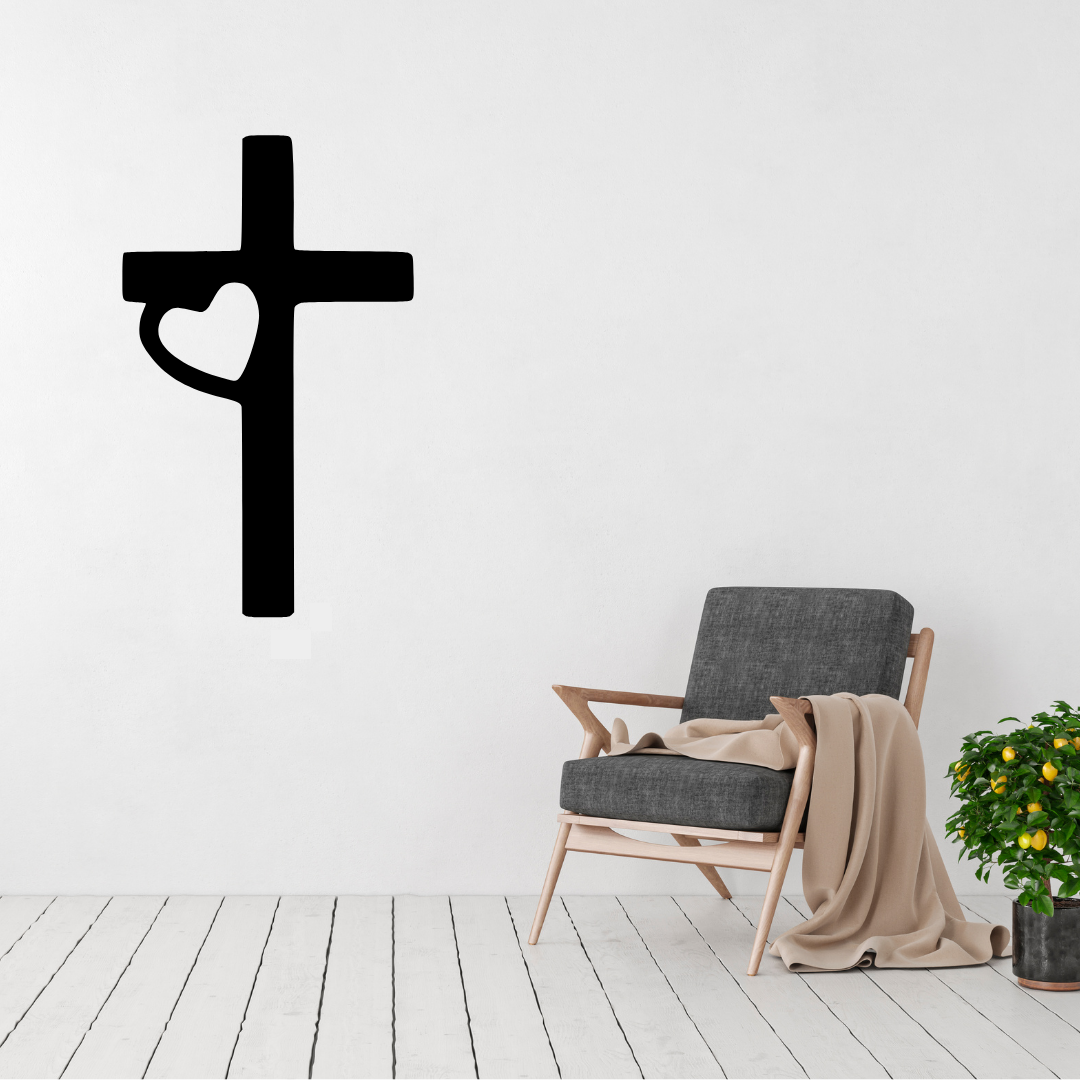 Faith and Love cross heart metal wall art displayed above a contemporary chair in a modern interior