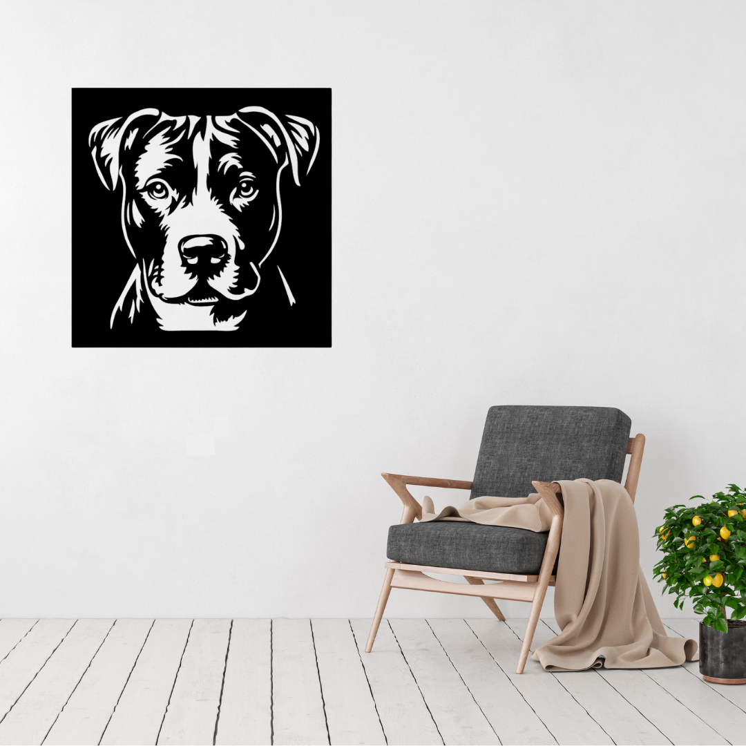 Faithful Eyes | Pitbull Portrait Metal Wall Art displayed on a modern living room wall above a grey accent chair, featuring a detailed Pitbull portrait in a bold square black metal design.