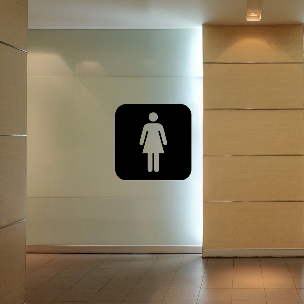 Female Toilet Symbol | Metal Bathroom Sign mounted on a contemporary restroom wall.