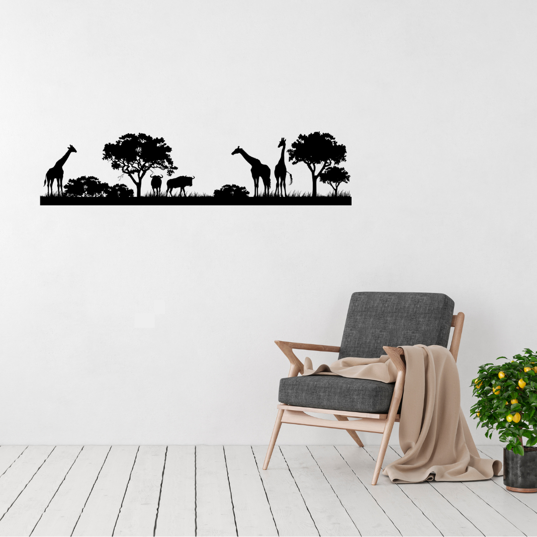 African savanna silhouette metal wall art featuring giraffes, wildebeest and acacia trees in a room with a contemporary chair