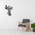 Gravity Defied | Freestyle Motocross Metal Wall Art displayed in a modern living room.
