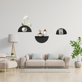 Halo Arc floating half-circle metal shelf styled in a modern living room with minimalist décor