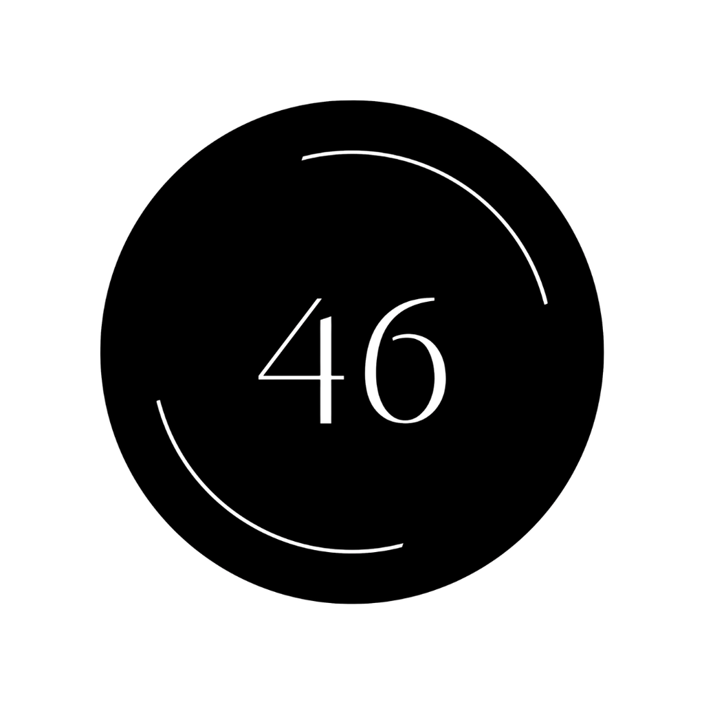Custom laser-cut round steel address plaque featuring clean curved accents surrounding the house number.