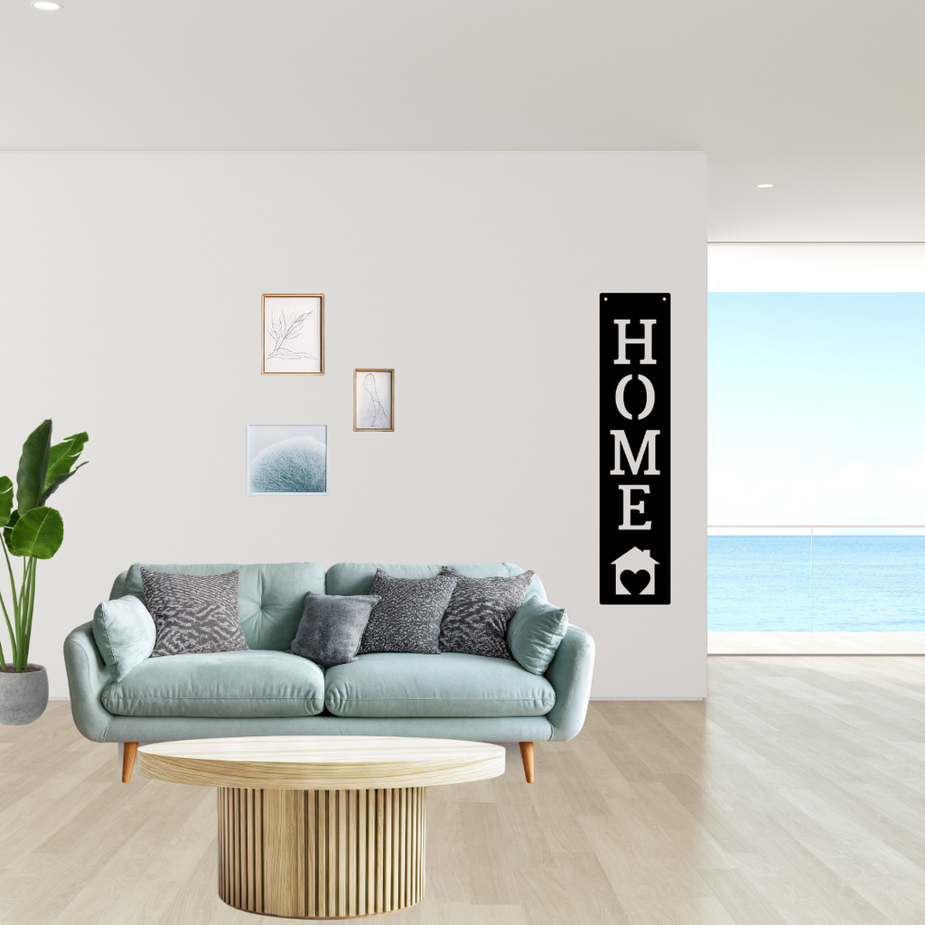 Heart of the Home | Home Vertical Metal Wall Sign showcased beside a contemporary lounge in a bright modern home.