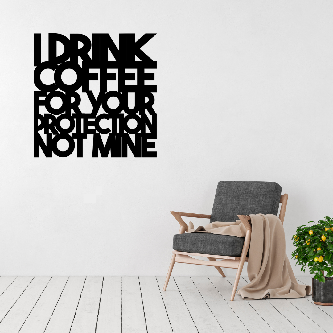 I Drink Coffee for Your Protection Not Mine | Funny Coffee Metal Wall Art displayed in a modern living space above a contemporary accent chair.